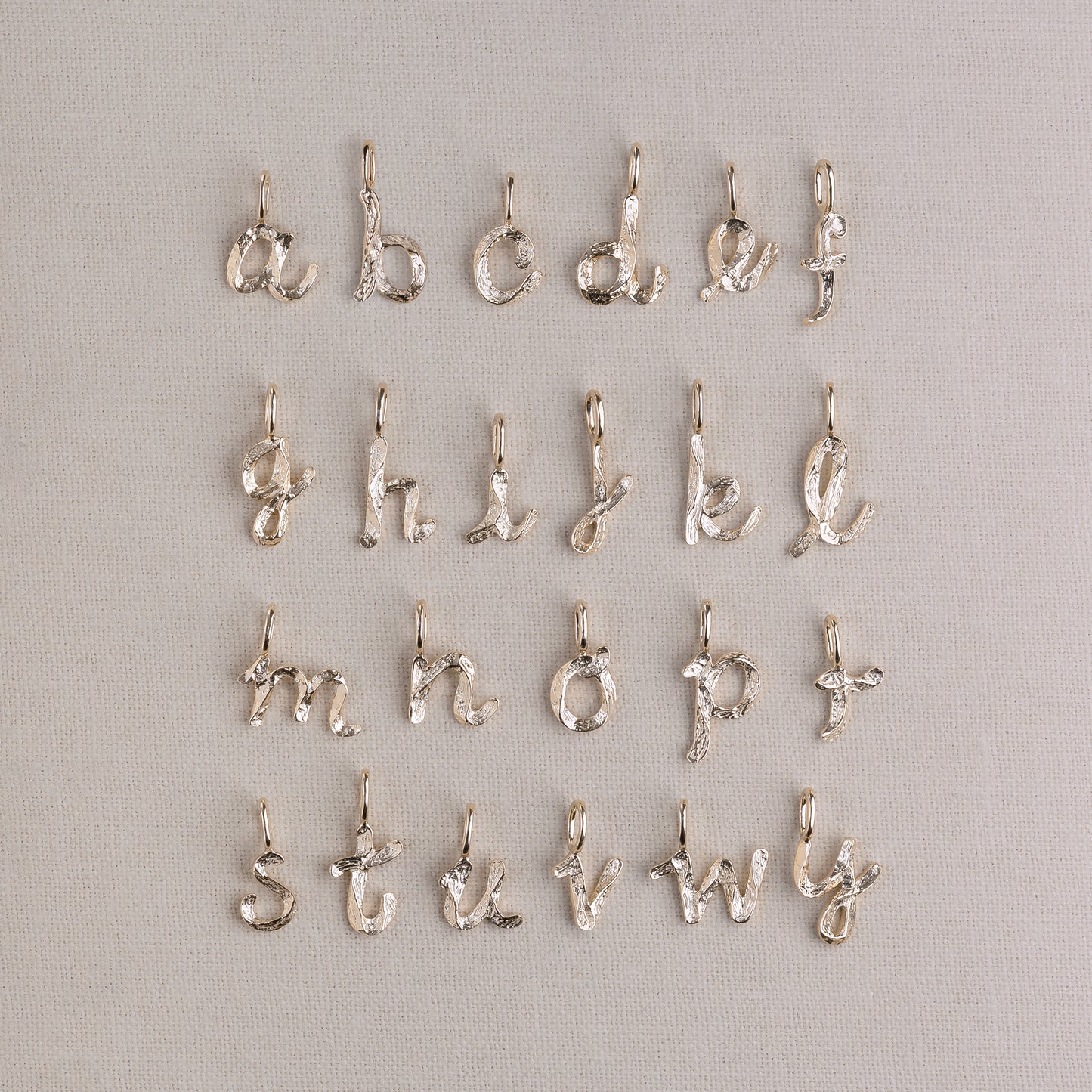 Handwritten Letter Charm 375 9k solid gold massivt guld pendant håndskrevet vedhæng bogstav HandcraftedCPH handcrafted Copenhagen handmade Danish design molten organic texture symbol petit cute smeltet organisk bogstaver letters