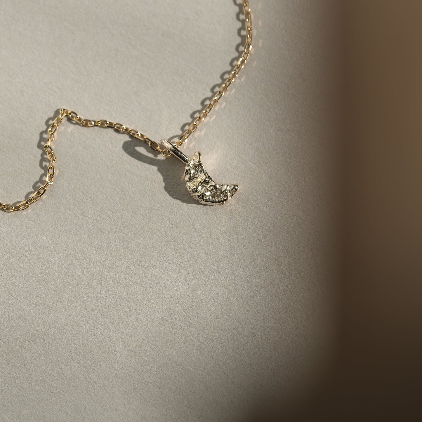 Moon charm pendant 9k 375 guld solid gold feminine feminin måne cute petite dainty intricate molten textured tekstur symbol classic klassisk simple simpel modern timeless elegant handcraftedcph handcrafted jewelry copenhagen handmade danish design contemporary
