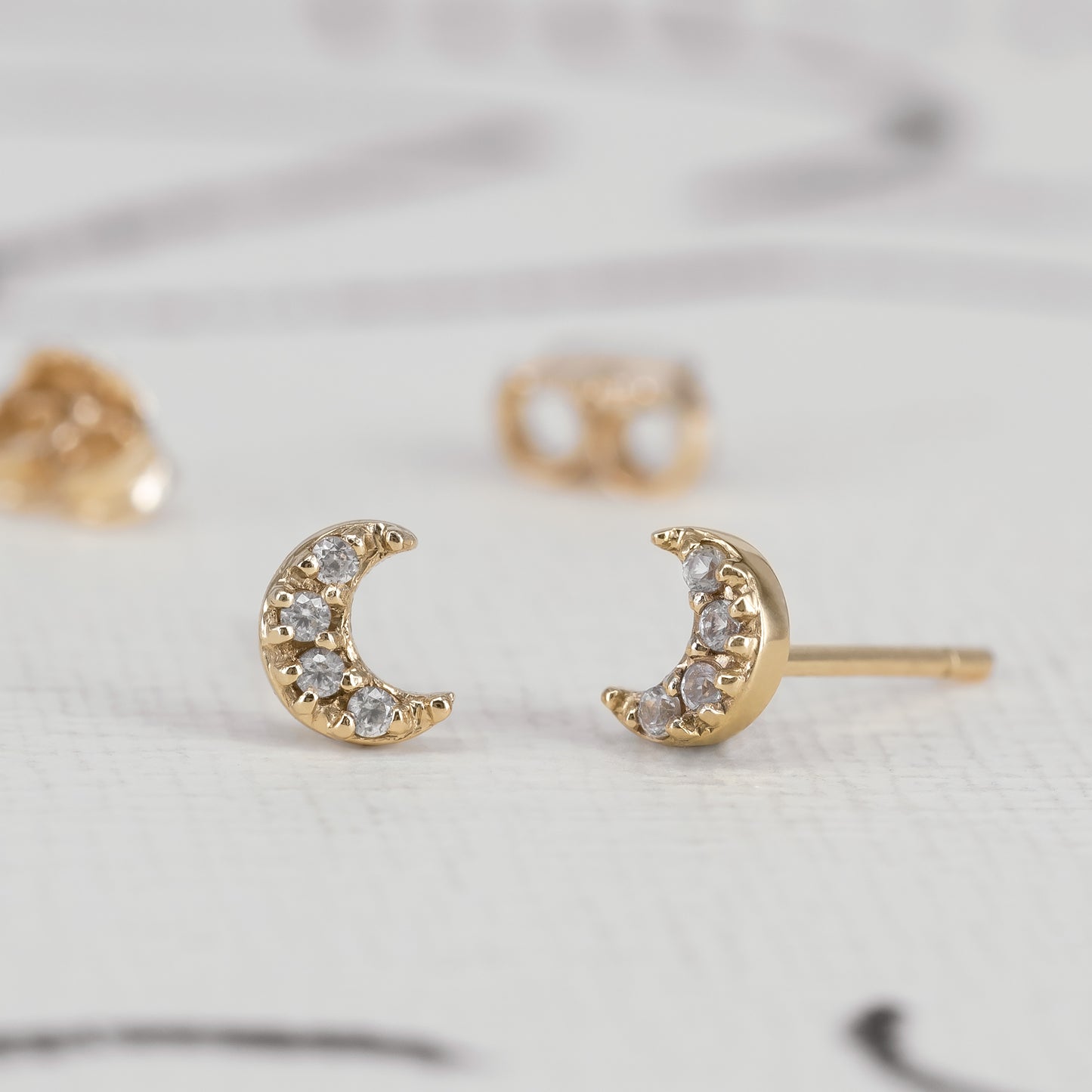Luna Ear Studs 375 9k solid gold massivt guld white sapphire hvid safir moon måne ørering HandcraftedCPH handcrafted handmade Copenhagen Danish design dainty