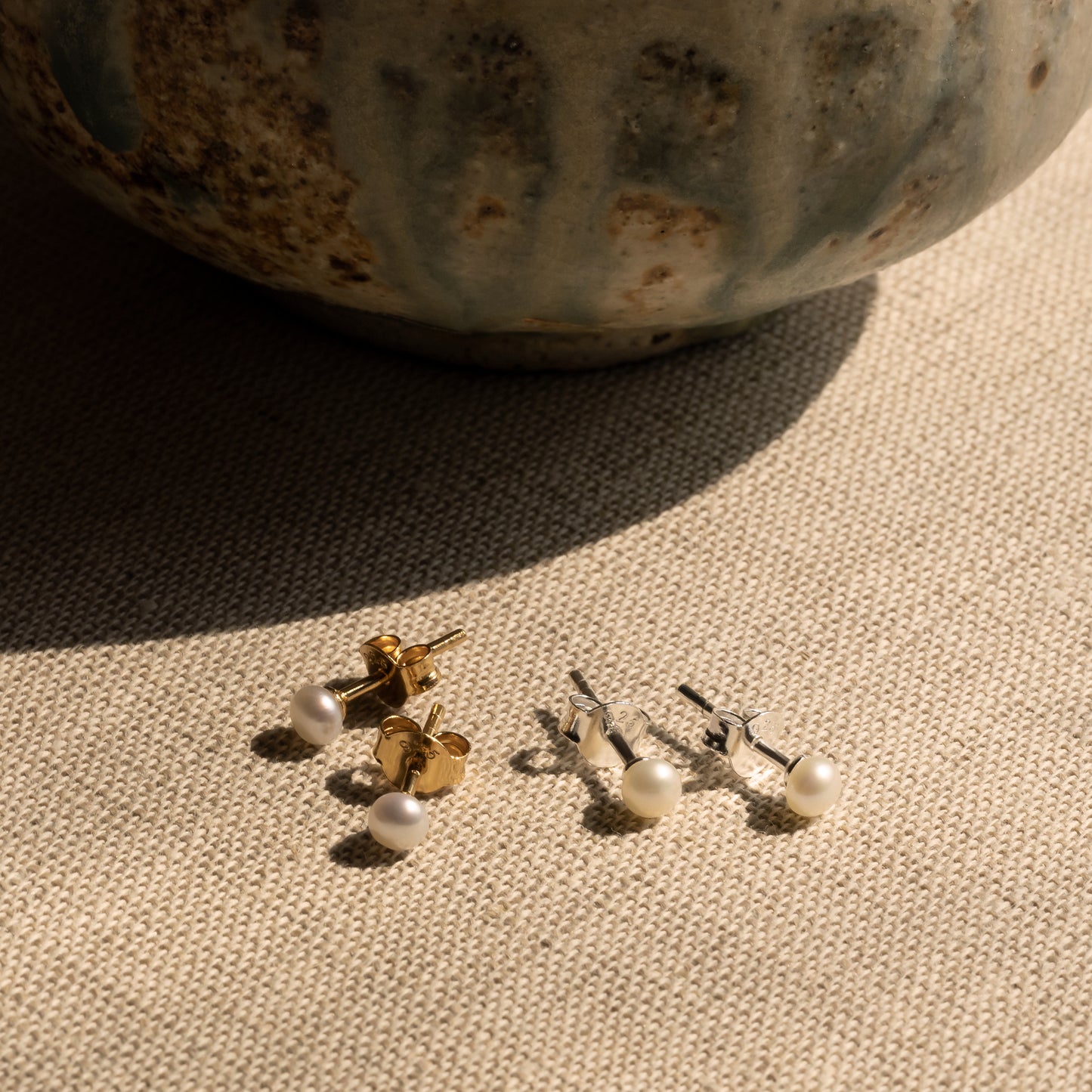 Nima pearl ear studs handcraftedcph handcrafted cph sterling silver 18k gold plated forgyldt sølv ferskvandsperle perleørering perleørestikker freshwater pearls natural ear sticks handmade classic danish design copenhagen earrings